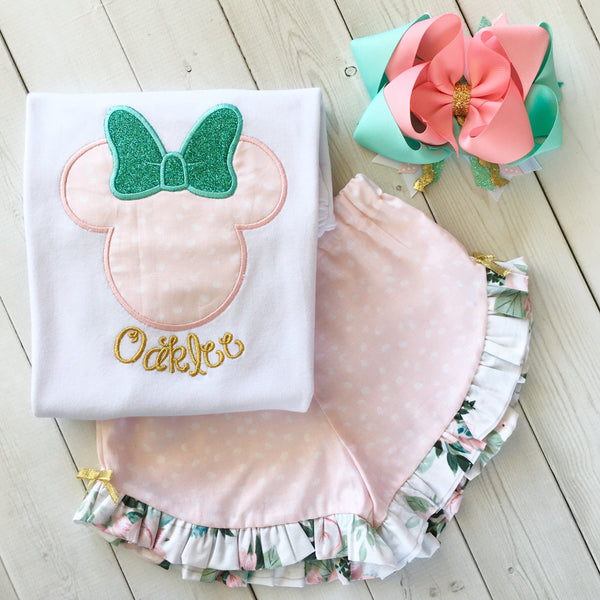 Gorgeous Disney outfit for girls, toddlers and babies. Minnie-like silhouette done in pretty pink flower petals and aqua glitter bow. Matching petals and floral ruffled shorts are perfection!