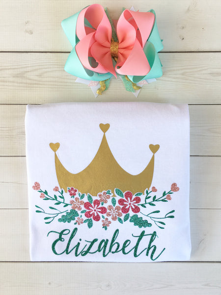 Gorgeous princess shirt for girls, toddlers and babies. Gold crown covered in glitter pink flowers customized with full name. 