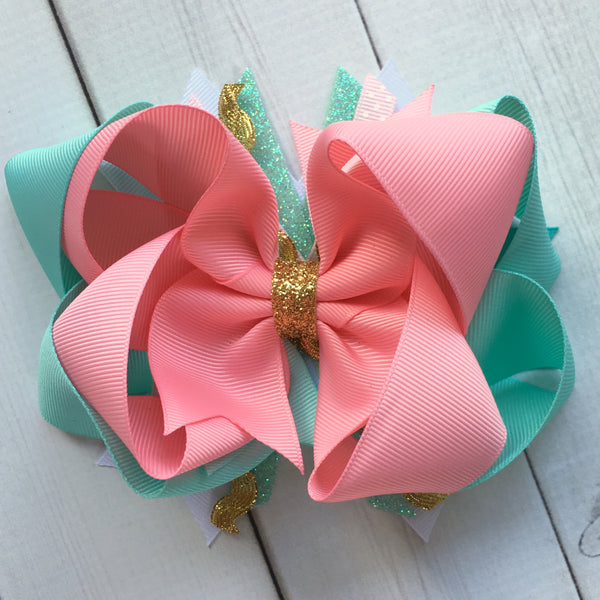 Gorgeous double stacked boutique hairbow for girls, toddlers and babies. FIlled with pink, aqua and gold glitter accent ribbon.