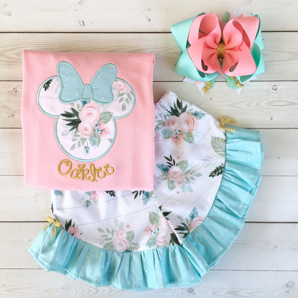 Gorgeous Disney outfit for girls, toddlers and babies. Minnie-like silhouette done in pretty floral fabir and aqua dot bow. Matching floral ruffled shorts are perfection!
