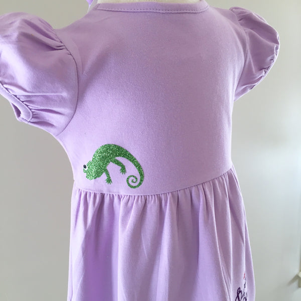 Disney dresses for girls toddlers babies. Tangled Inspired, Rapunzel inspired disney dress for girls on lavender dress with personalized glitter monogram on bodice and fully decorated skirt with best day ever and matching bow